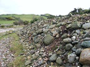 Stones dredged to river bank is a problem for habitat 